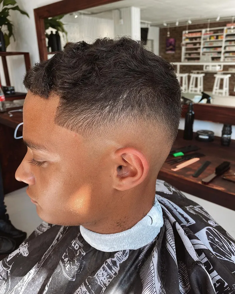 Wavy top, high skin fade